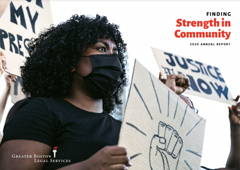 Photo of the front cover of GBLS' 2020 Annual Report. It features a woman at a protest holding a sign showing a raised fist.