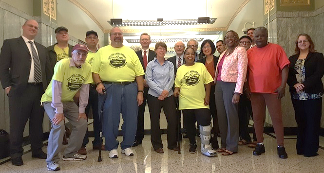 Group of community members, advocates, and GBLS attorneys at the State House