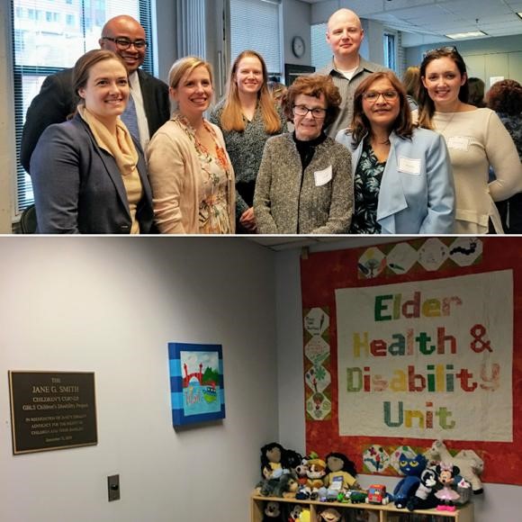 Volunteer Jane Smith and her family and colleagues are pictured smiling together. Below: a photo of the plaque commemorating the dedication of the children's play space, also showing toys and artwork.