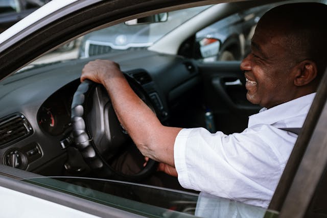 man in car smiling