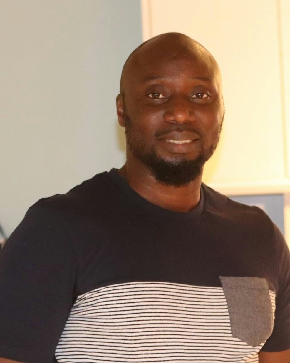 stock photo of a black man smiling at the camera