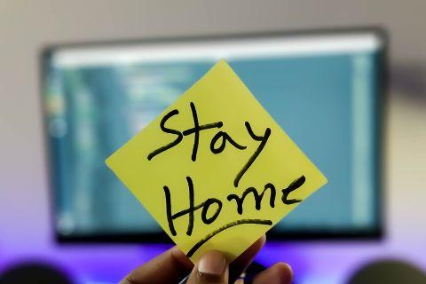 Sticky note with Stay Home written on it