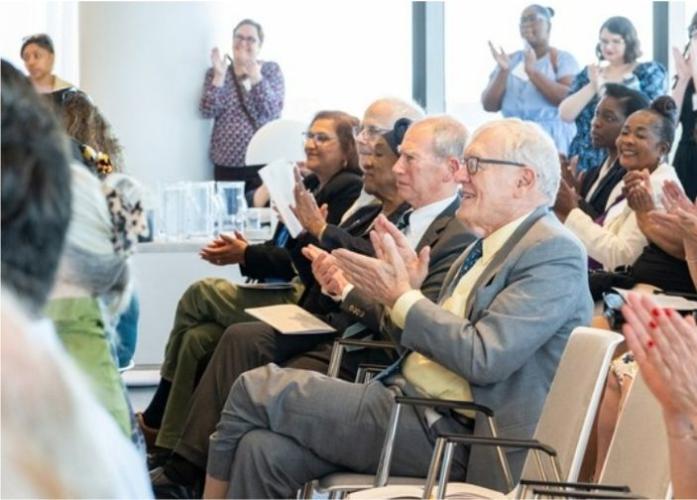 GBLS board, staff, and community members applaud during the 2026 Annual Meeting